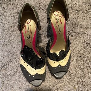 Poetic License Black and Cream Heels with Vintage Wingtip Design